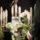 A man at a funeral home holds a white rose in front of an urn for your-funeral-home-needs-an-answering-service blog.